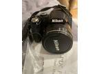 NIKON COOLPIX P90 (pre-owned) w/ Battery, Battery Charger &