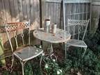 Antique iron chairs and table.great in the garden or on