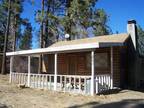 Cozy, quiet two bedroom, one bathroom cabin located on a large lot