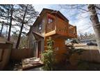 Cute two-story, family cabin with forest views