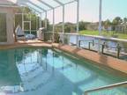 Beautiful South Gulf Cove Pool Home, with boat dock!