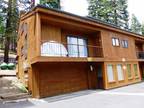 4br, wood finishes and stone fireplace