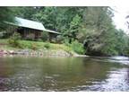 $125 / 3br - COZY RIVERFRONT CABIN, PREMIER FISHING, HOT TUB!