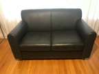 Black Leather love seat sofa, slightly worn, 30 x 55.