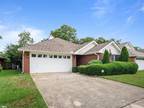 All brick, low maintenance home located in popular Magnolia Village.