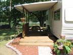 1977 Arrowhead Trailer Lake Front property that flows into Little Blue River in