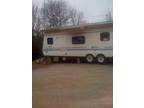 late model 32 ft. Achiever RV with new custom metal roof and awning