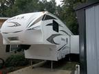 2010 KEYSTONE OUTBACK 5th wheel with a 56 month WAARANTY included -