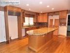 Maple Kitchen With Island And Granite Counter Tops