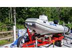 10foot 2inch Inflatable, centerr console,trailer & 20 Mercury