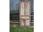 Weathered old red panel door - Opportunity
