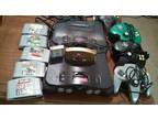 Two nintendo 64s one smoke clear which has cords, super smash, n more