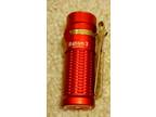 Olight Baton 3 Red flashlight with charge cable and battery
