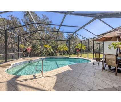 Florida Home with Salt Water Pool at 3330 45th Ave E in Bradenton FL is a Single-Family Home