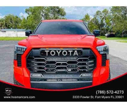 2022 Toyota Tundra Hybrid CrewMax for sale is a Red 2022 Toyota Tundra 1794 Trim Hybrid in Fort Myers FL