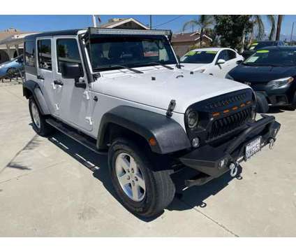 2015 Jeep Wrangler for sale is a White 2015 Jeep Wrangler Car for Sale in Bloomington CA