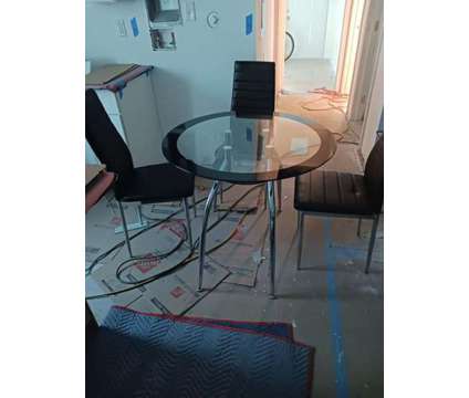 Qty 4 Glass Tables and 4 Chairs per Table is a Tables &amp; Stands for Sale in Miami FL