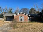 Perry, HUD Home Sold "As-Is". 3 BR/2 BA 3-sided brick home