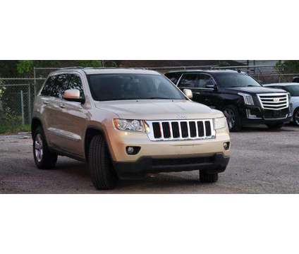 2011 Jeep Grand Cherokee for sale is a Tan 2011 Jeep grand cherokee Car for Sale in South Houston TX