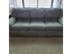 three piece living room set with double bed in couch