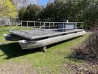 1974 Crest Pontoon boat, 25 feet long, with 2005 Mercury outboard motor.
