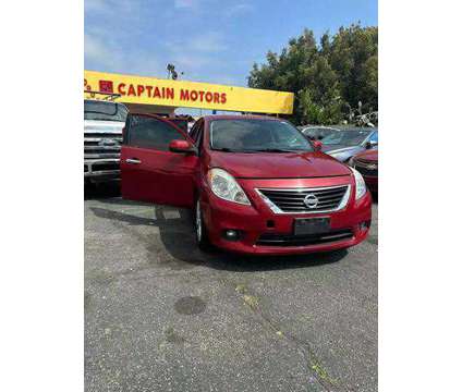 2014 Nissan Versa for sale is a Red 2014 Nissan Versa 1.6 Trim Car for Sale in Long Beach CA