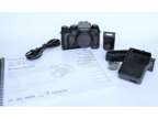Fuji X-T1 camera with owner's manual and accessories