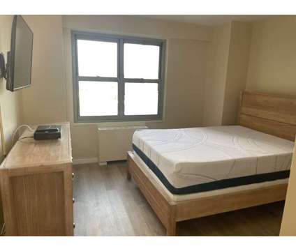 Spacious Newly Furnished Bedroom with Utilities at 120 De Kruif Place Bronx in New York NY is a Roommate