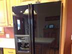 Refrigerator 25.4 Cubic Feet, Black, Side-by-side, Water indoor