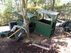 Trailers (2) Tractor Supply with Dumping option. Link together, have tin roofs