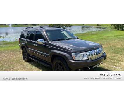 2003 Jeep Grand Cherokee for sale is a Grey 2003 Jeep grand cherokee Car for Sale in Haines City FL