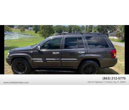 2003 Jeep Grand Cherokee for sale is a Grey 2003 Jeep grand cherokee Car for Sale in Haines City FL