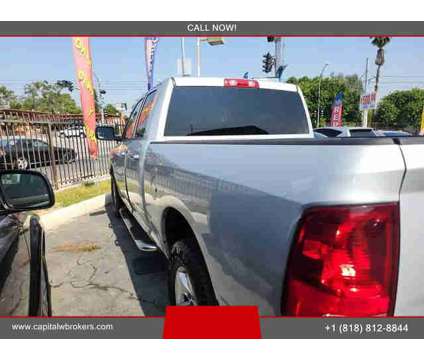 2014 Ram 1500 Quad Cab for sale is a Grey 2014 RAM 1500 Model Car for Sale in Los Angeles CA