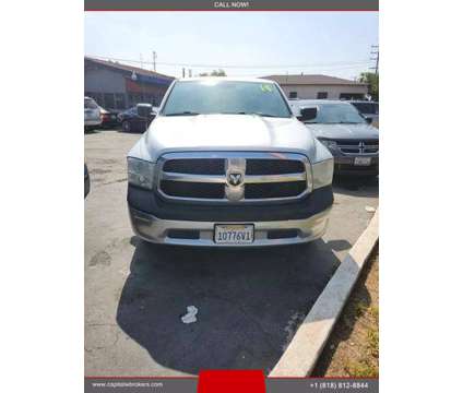 2014 Ram 1500 Quad Cab for sale is a Grey 2014 RAM 1500 Model Car for Sale in Los Angeles CA