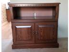 SOLD WOOD TV. STAND (excellent condition)