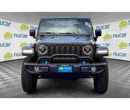 2023 Jeep Wrangler 4XE Rubicon 4xe is a Black 2023 Jeep Wrangler Rubicon SUV in Tilton NH