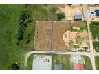 Grove, 1/2 Acre (m/l) lot in the Industrial annex just east
