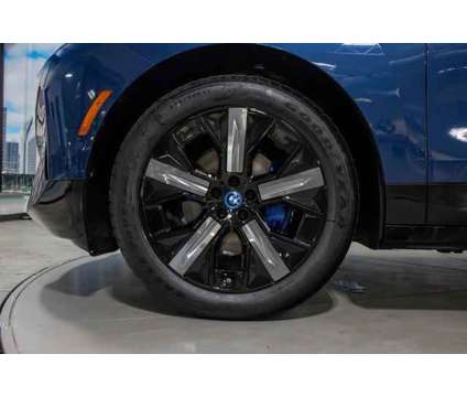 2024 BMW iX xDrive50 is a Blue 2024 BMW 325 Model iX SUV in Lake Bluff IL