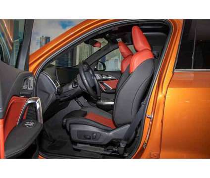 2023 BMW X1 xDrive28i is a Orange 2023 BMW X1 xDrive 28i SUV in Lake Bluff IL