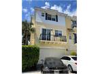 3 story townhome (End Unit) with a 2 car garage and elevator that backs up to a