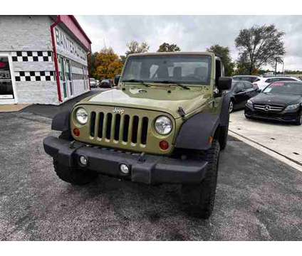 2013 Jeep Wrangler for sale is a Green 2013 Jeep Wrangler Car for Sale in Wichita KS