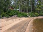 Riverfront property featuring modernized log home