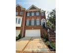 4 levels brick front River Creek Townhome.