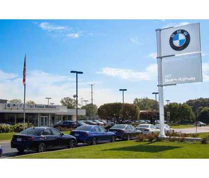 2024 BMW iX xDrive50 is a Red 2024 BMW 325 Model iX SUV in Lake Bluff IL