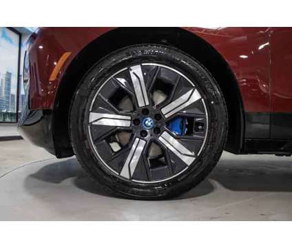 2024 BMW iX xDrive50 is a Red 2024 BMW 325 Model iX SUV in Lake Bluff IL