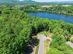 Candler, This gently sloping 1.12 acre LAKEFRONT homesite in