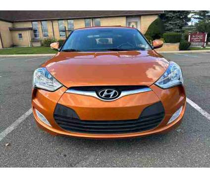 2017 Hyundai Veloster for sale is a Orange 2017 Hyundai Veloster 2.0 Trim Car for Sale in Paterson NJ
