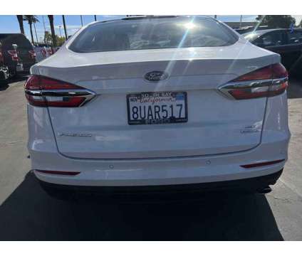 2020UsedFordUsedFusionUsedFWD is a Silver, White 2020 Ford Fusion Car for Sale in Hawthorne CA