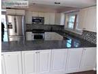 Kitchen Cabinets With Appliances And Granite Counters