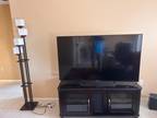65 in Sony Bravia tv 7 years old plus an intertainment Unit unit